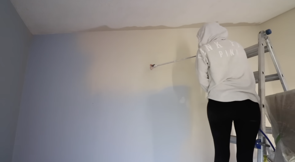 painting the walls with the paint sprayer 